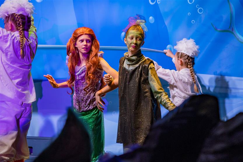 Students perform onstage